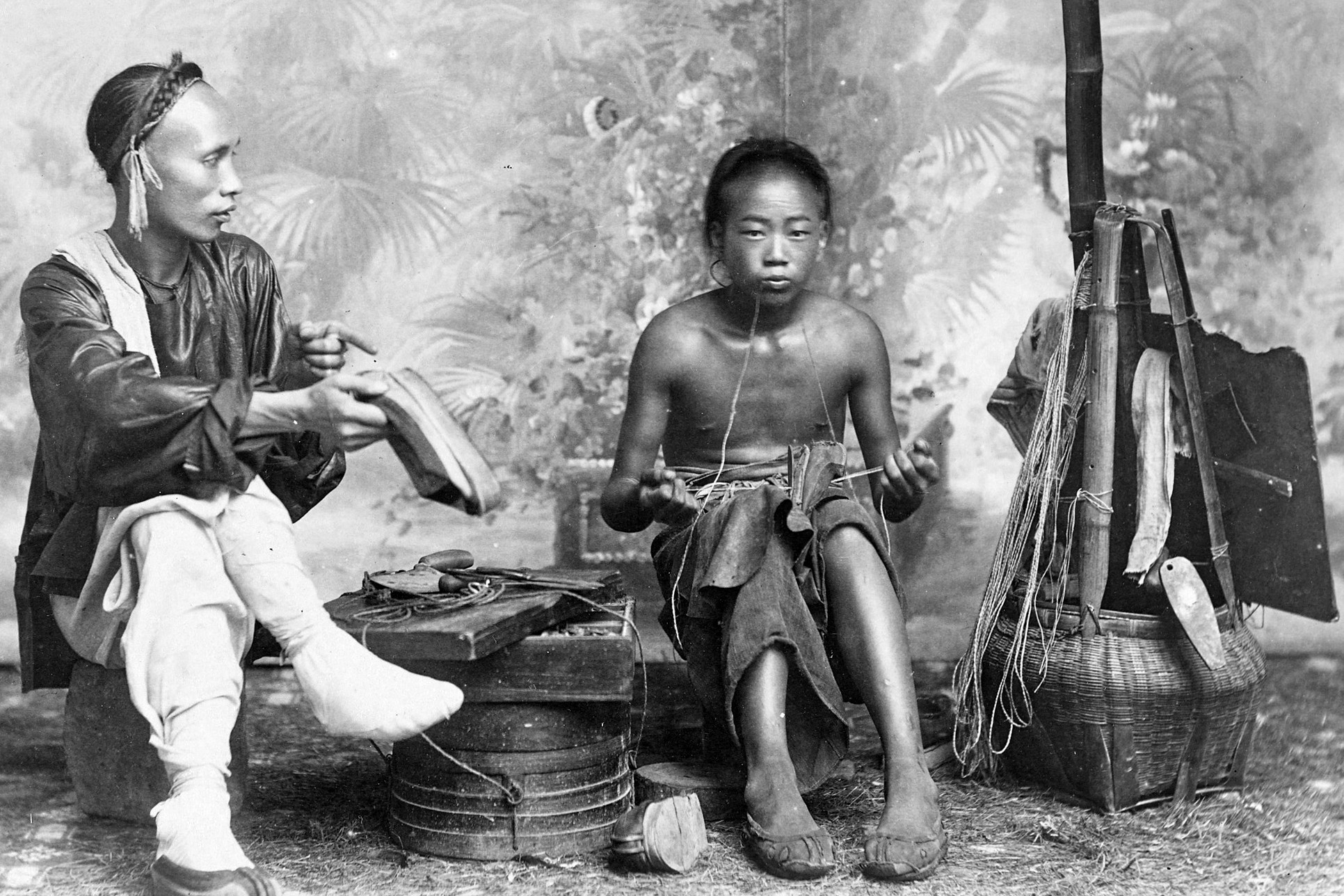 A Chinese child repairing shoes, late 19th century
