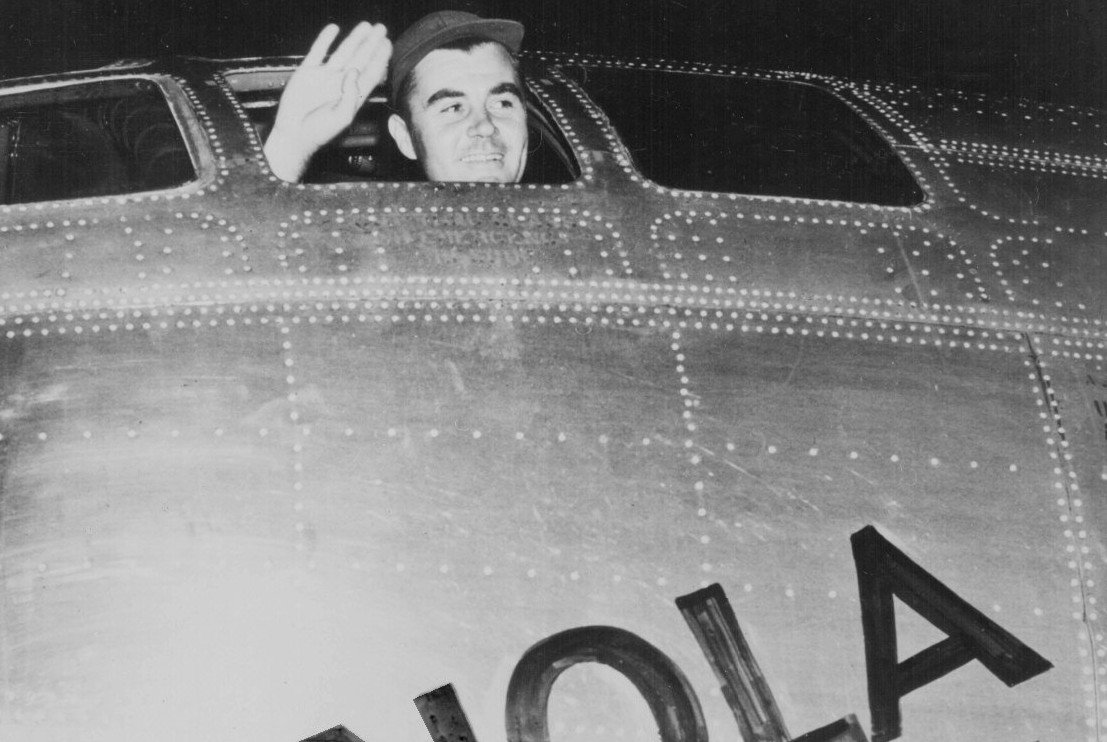 Paul Tibbets waving from Enola Gay's cockpit before taking off for the bombing of Hiroshima in 1945.