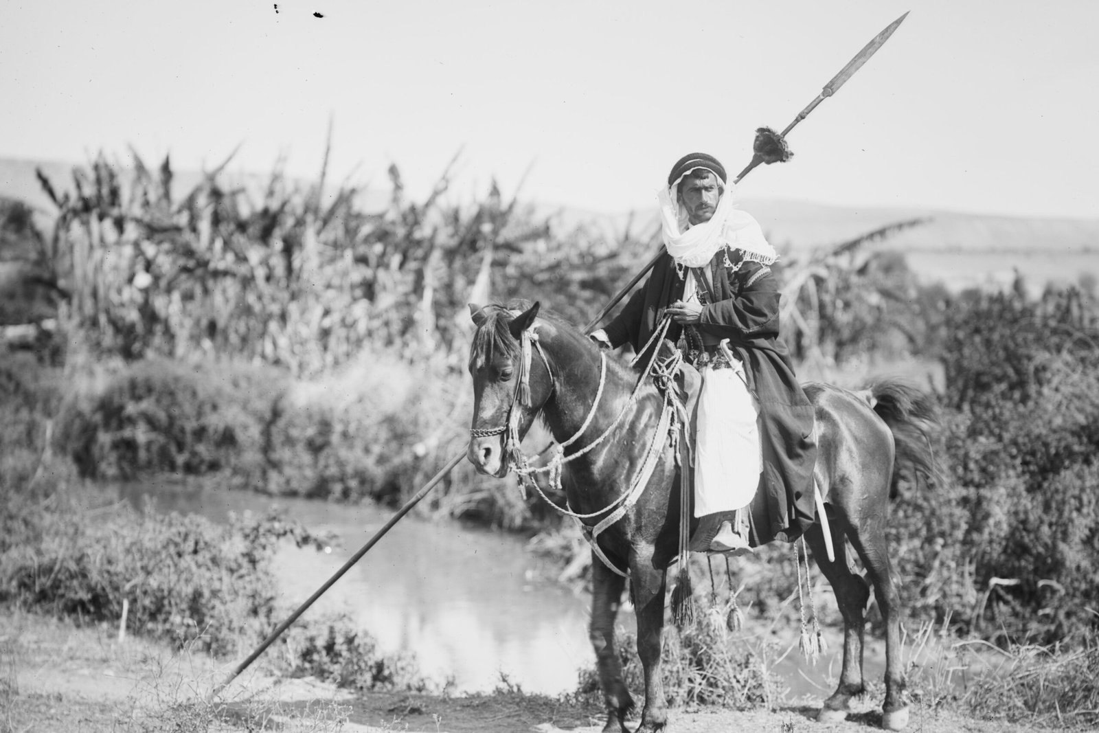 A Bedouin Arab warrior carrying a long hunting az-zaġāyah c. 1914.